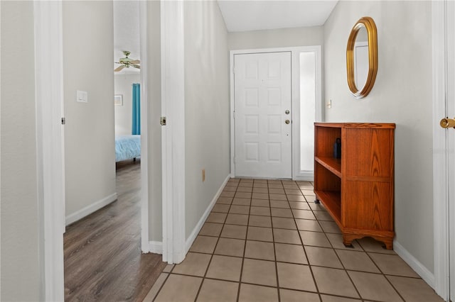 entryway with ceiling fan and hardwood / wood-style flooring