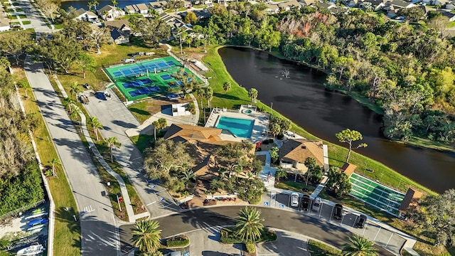 birds eye view of property with a water view