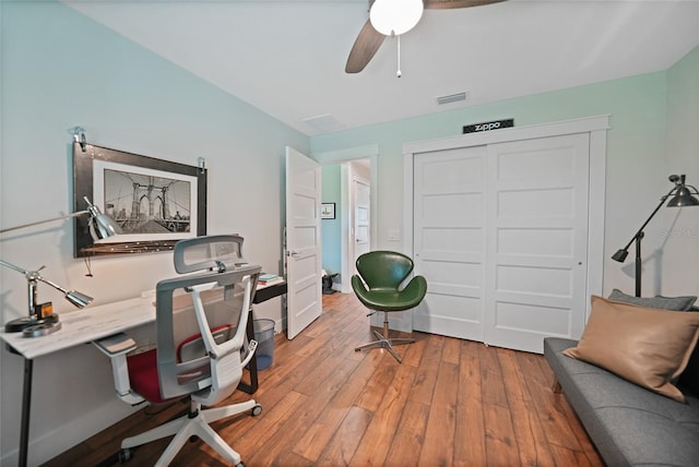 office space featuring ceiling fan and hardwood / wood-style flooring