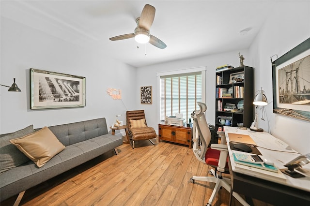 home office featuring light wood-type flooring and ceiling fan