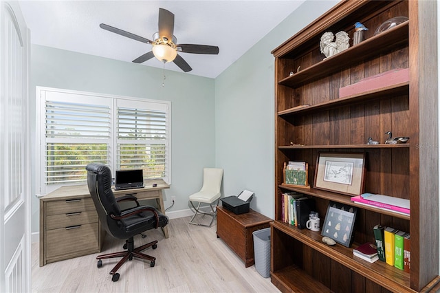 home office with ceiling fan and light wood-type flooring