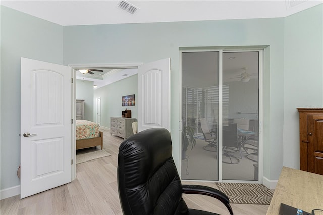 home office featuring light hardwood / wood-style flooring and ceiling fan