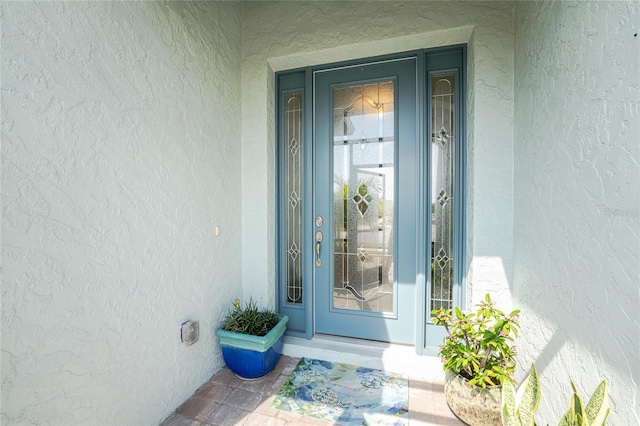 552 Box Elder Ct, Englewood, FL 34223 - doorway to property featuring stucco siding