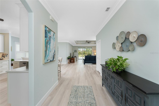 552 Box Elder Ct, Englewood, FL 34223 - hall with visible vents, light wood-style flooring, baseboards, and ornamental molding