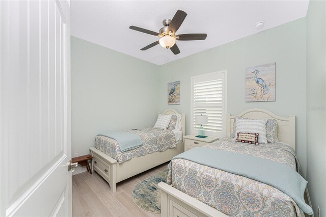 552 Box Elder Ct, Englewood, FL 34223 - bedroom with light wood-type flooring and ceiling fan