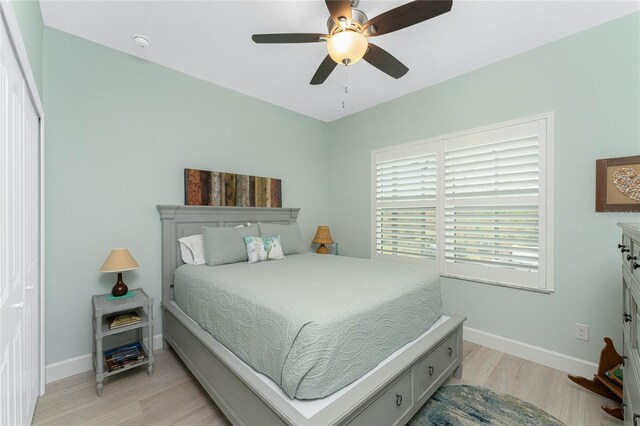 552 Box Elder Ct, Englewood, FL 34223 - bedroom with baseboards, light wood-type flooring, and ceiling fan
