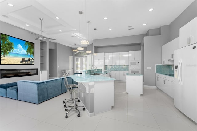 14344 Amestoy Ave, Port Charlotte, FL 33981 - kitchen with a sink, open floor plan, white appliances, recessed lighting, and backsplash