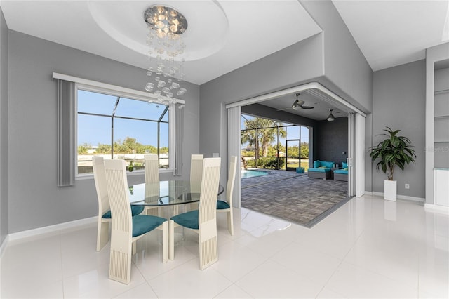 14344 Amestoy Ave, Port Charlotte, FL 33981 - dining space with a sunroom, a notable chandelier, and baseboards