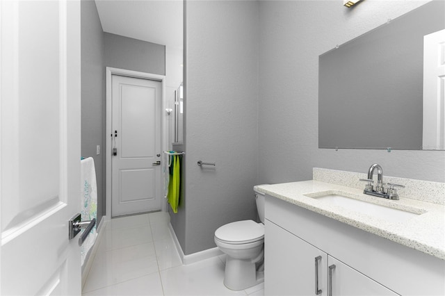 14344 Amestoy Ave, Port Charlotte, FL 33981 - bathroom featuring toilet, tile patterned floors, vanity, and baseboards