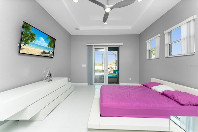 14344 Amestoy Ave, Port Charlotte, FL 33981 - bedroom featuring baseboards, a ceiling fan, a tray ceiling, recessed lighting, and access to exterior