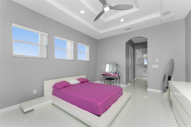 14344 Amestoy Ave, Port Charlotte, FL 33981 - bedroom with arched walkways, visible vents, recessed lighting, a raised ceiling, and baseboards