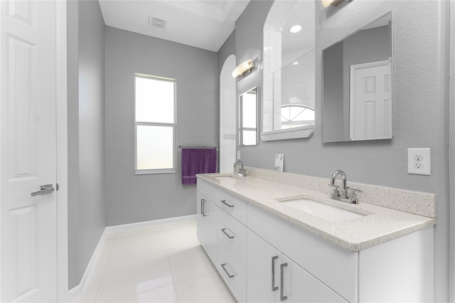 bathroom featuring tile patterned flooring and vanity