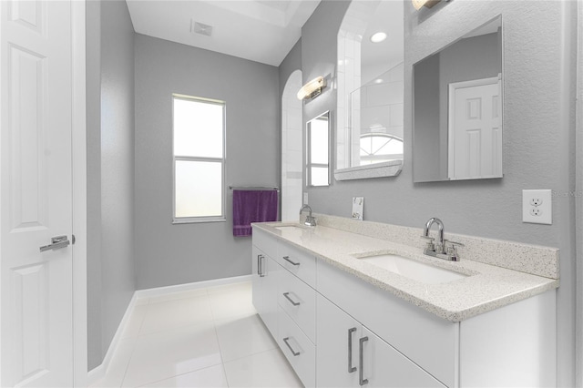 14344 Amestoy Ave, Port Charlotte, FL 33981 - full bath featuring a sink, visible vents, tile patterned floors, and double vanity