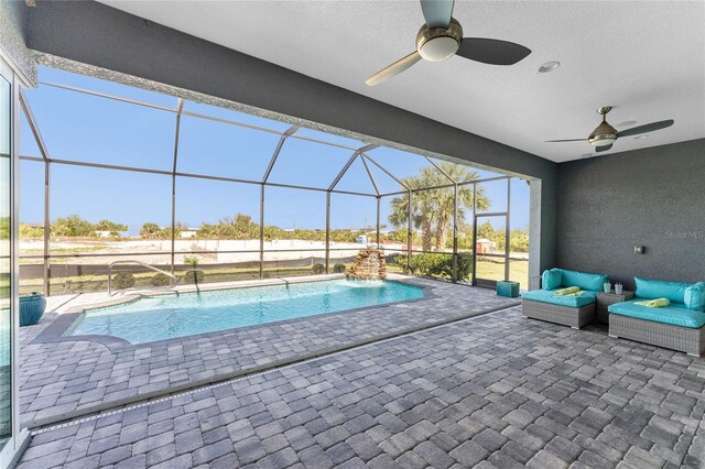 14344 Amestoy Ave, Port Charlotte, FL 33981 - outdoor pool with a patio area, ceiling fan, and glass enclosure