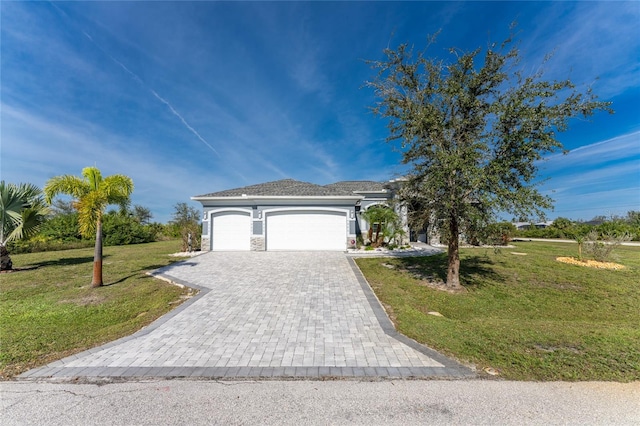 view of front of home with a garage and a front yard