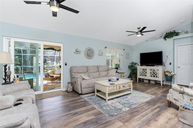 living room featuring vaulted ceiling, dark hardwood / wood-style flooring, and ceiling fan