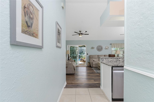 13511 Foresman Blvd, Port Charlotte, FL 33981 - hallway with a textured wall and light tile patterned floors