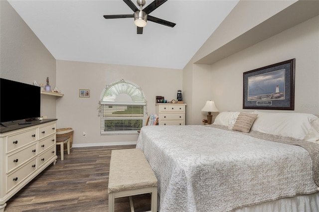 bedroom featuring vaulted ceiling, dark hardwood / wood-style flooring, and ceiling fan