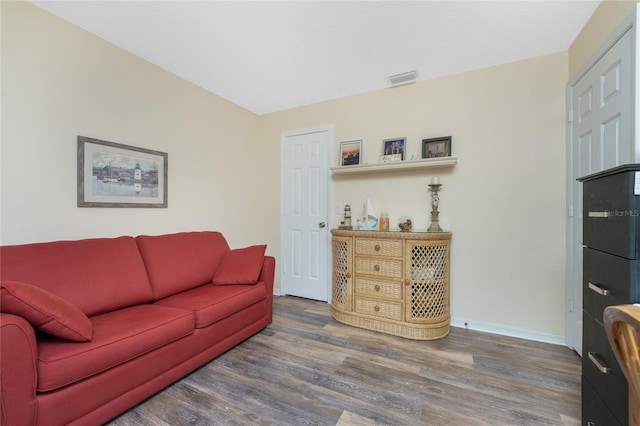 living room with dark wood-type flooring