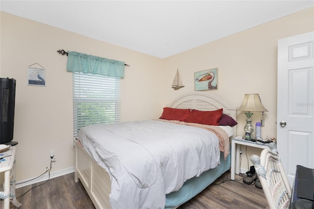 bedroom featuring dark hardwood / wood-style flooring