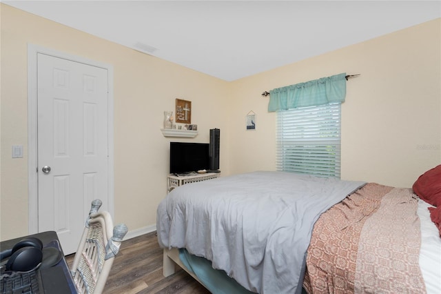 bedroom featuring dark hardwood / wood-style floors