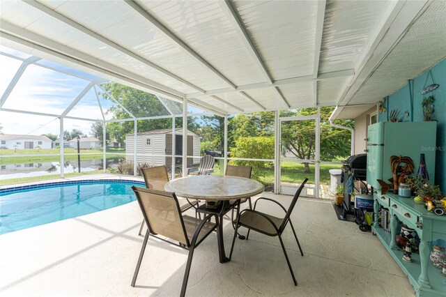 exterior space with a storage shed, a patio, and a lanai