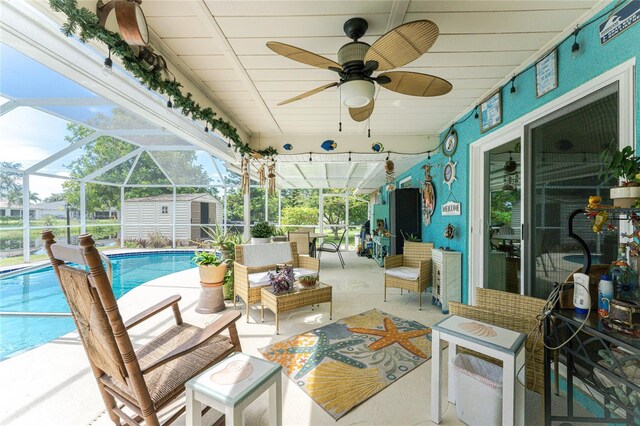13511 Foresman Blvd, Port Charlotte, FL 33981 - view of patio featuring an outdoor living space, an outbuilding, a storage shed, a ceiling fan, and glass enclosure