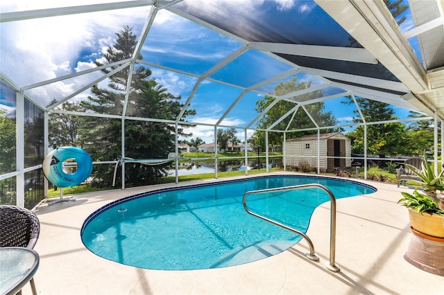 view of swimming pool with a storage unit, a water view, a lanai, and a patio area