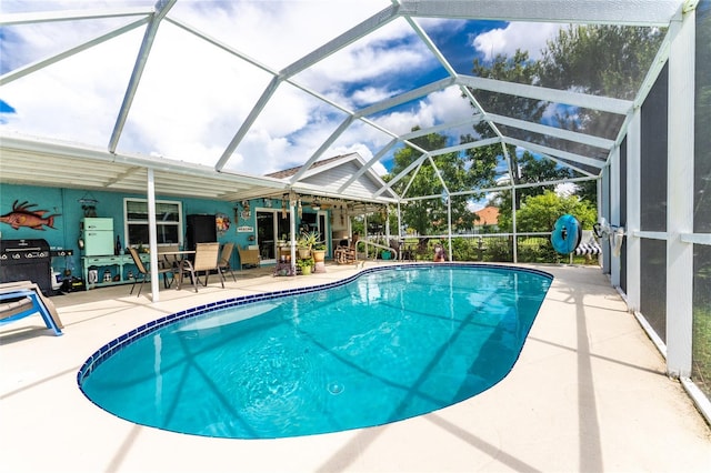 13511 Foresman Blvd, Port Charlotte, FL 33981 - pool featuring a grill, a patio area, and a lanai