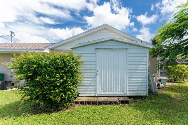 view of outdoor structure with a yard