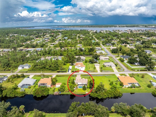 bird's eye view with a water view