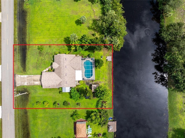 birds eye view of property with a water view