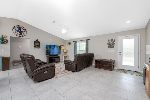 tiled living room with ceiling fan and vaulted ceiling