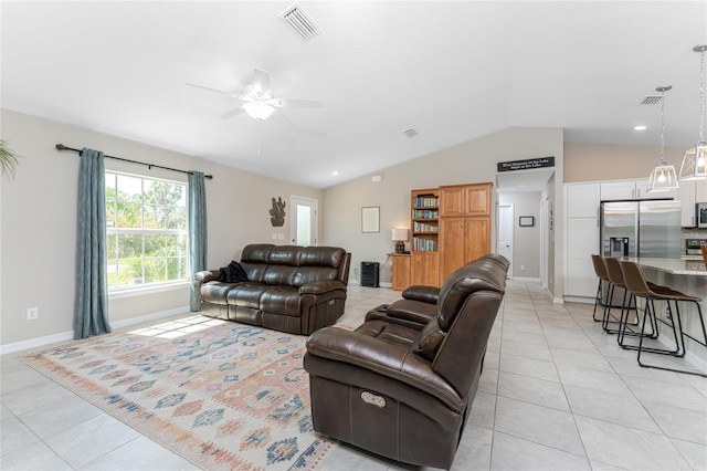 tiled living room featuring lofted ceiling and ceiling fan