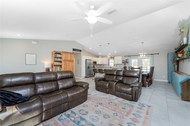 tiled living room with lofted ceiling and ceiling fan