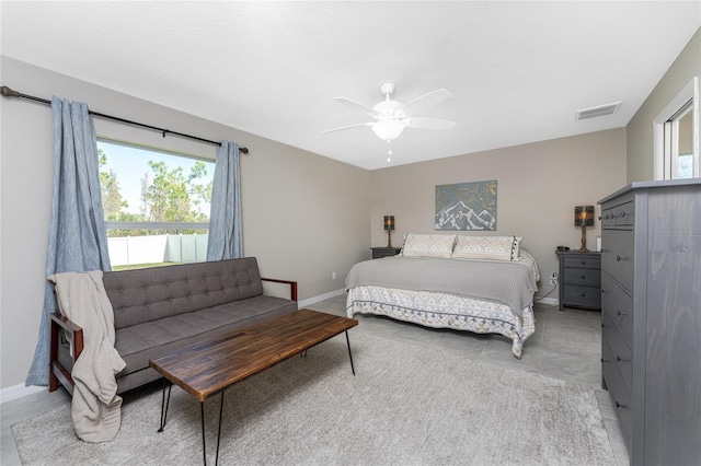 tiled bedroom with ceiling fan