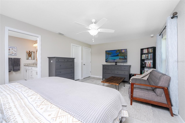 bedroom with ceiling fan and ensuite bath