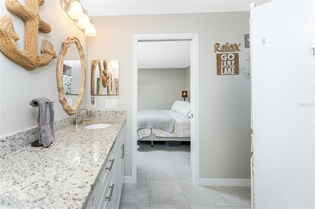 bathroom with vanity and tile patterned floors