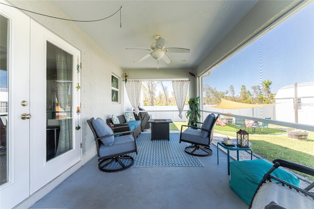 sunroom / solarium with ceiling fan