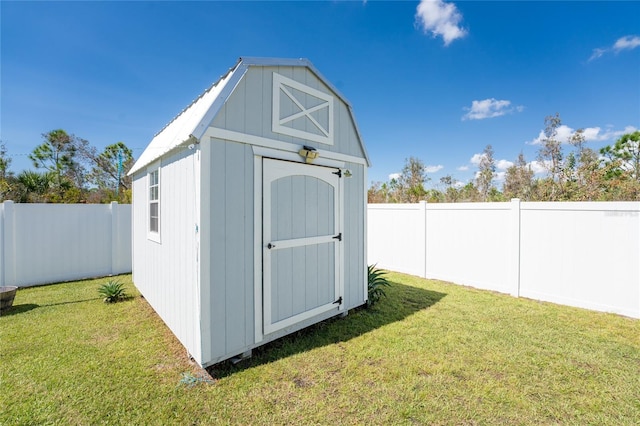 view of outbuilding featuring a lawn