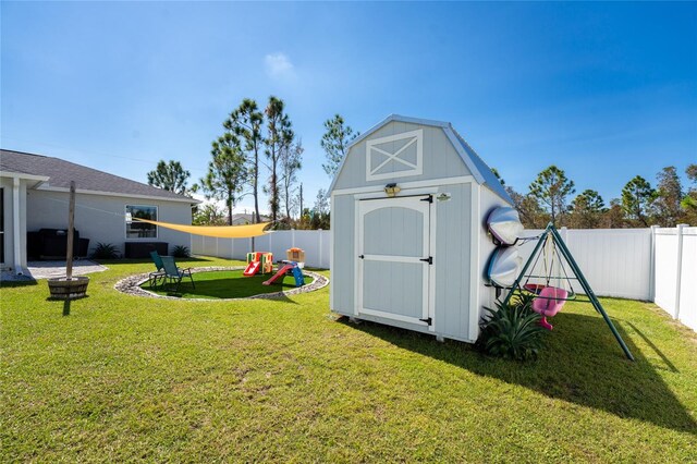 view of outdoor structure with a lawn and a playground