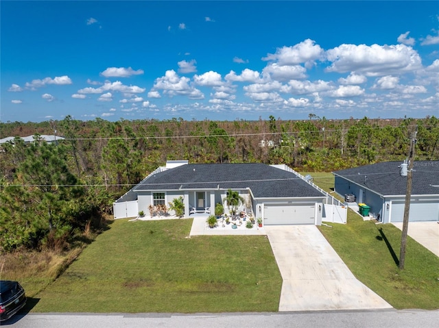 single story home with a front yard and a garage