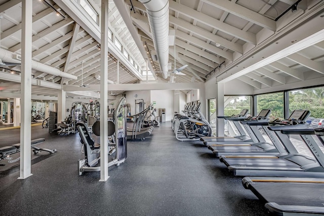 gym featuring ceiling fan and high vaulted ceiling