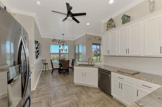 kitchen with white cabinetry, stainless steel fridge, light stone countertops, and dishwasher