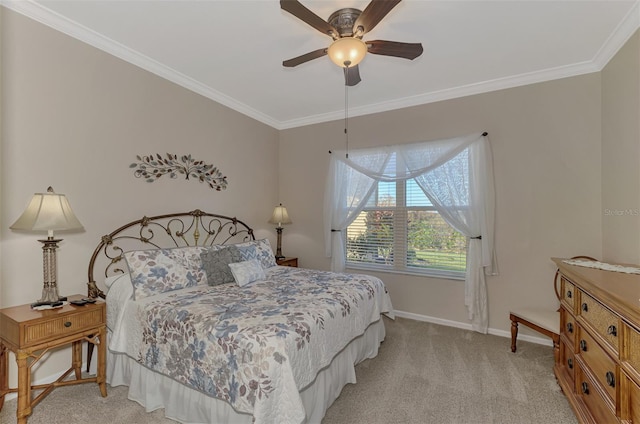 carpeted bedroom featuring crown molding and ceiling fan