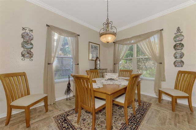 dining area featuring ornamental molding and light hardwood / wood-style floors