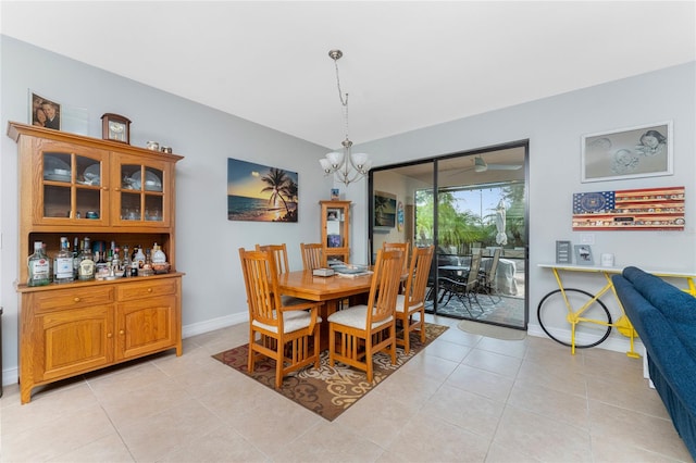 dining room with light tile patterned floors and a chandelier