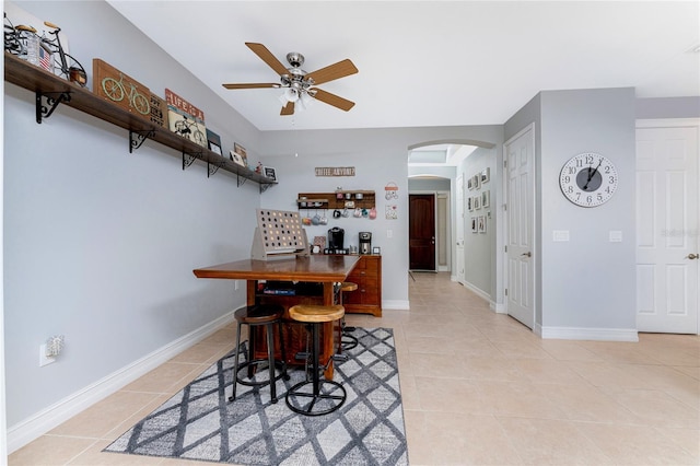 dining area featuring ceiling fan and light tile patterned floors