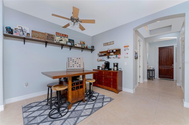 dining space featuring ceiling fan and light tile patterned flooring