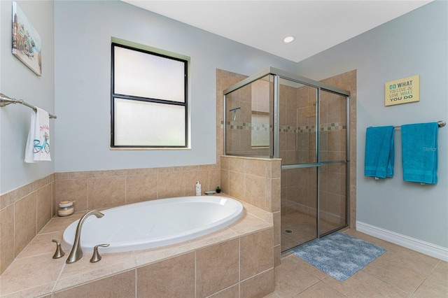 bathroom featuring independent shower and bath and tile patterned flooring